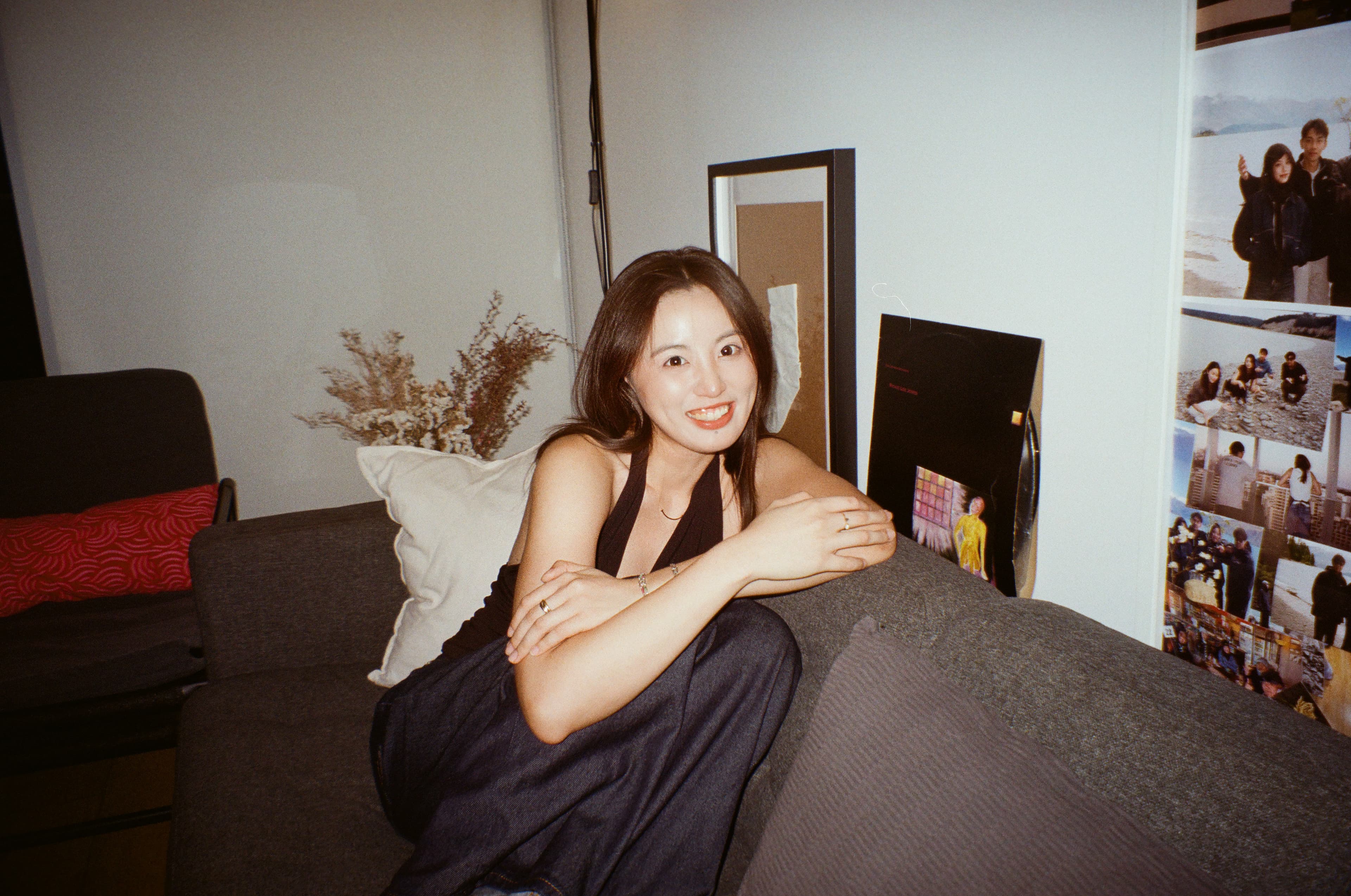 A film portrait of Eryou seated indoors