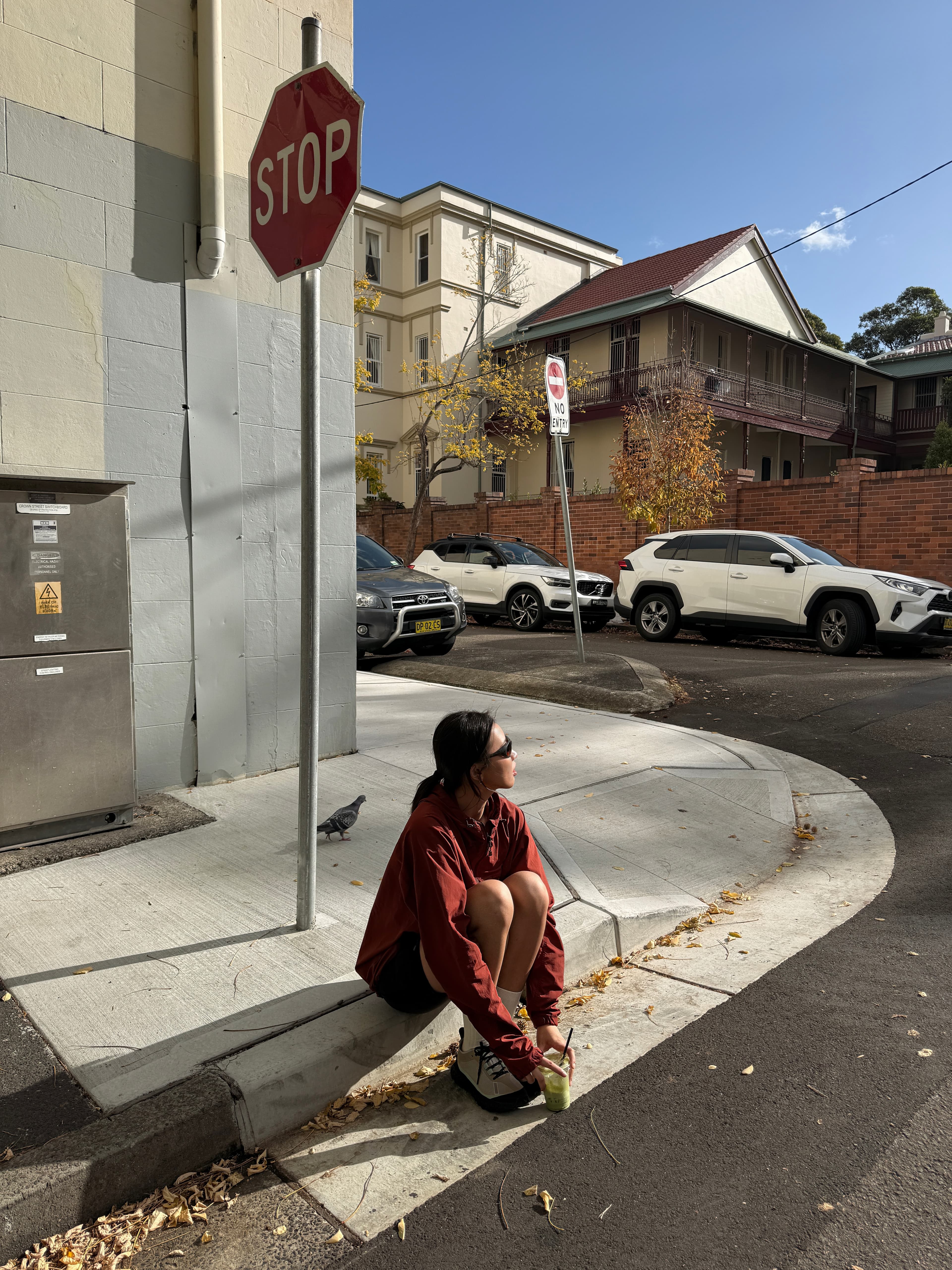 Eryou sitting at a Sydney street corner